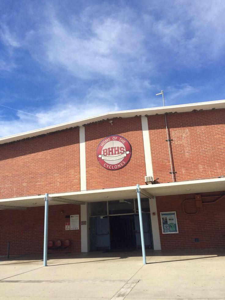 an empty building with a sign on the front