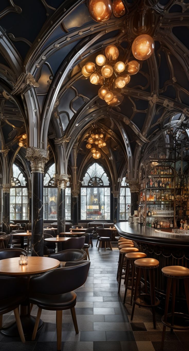 the inside of a restaurant with many tables and bar stools, chandeliers hanging from the ceiling