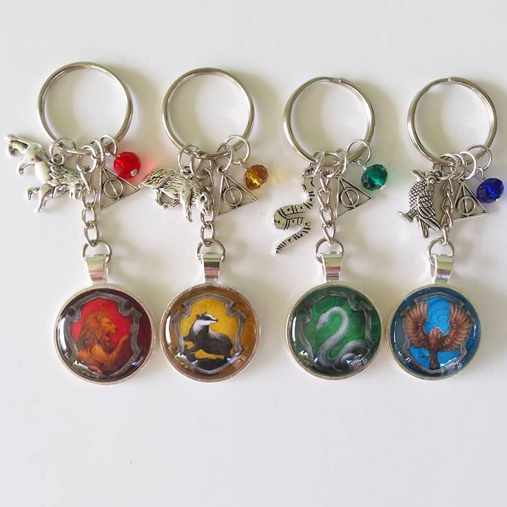 four key chains with different designs on them