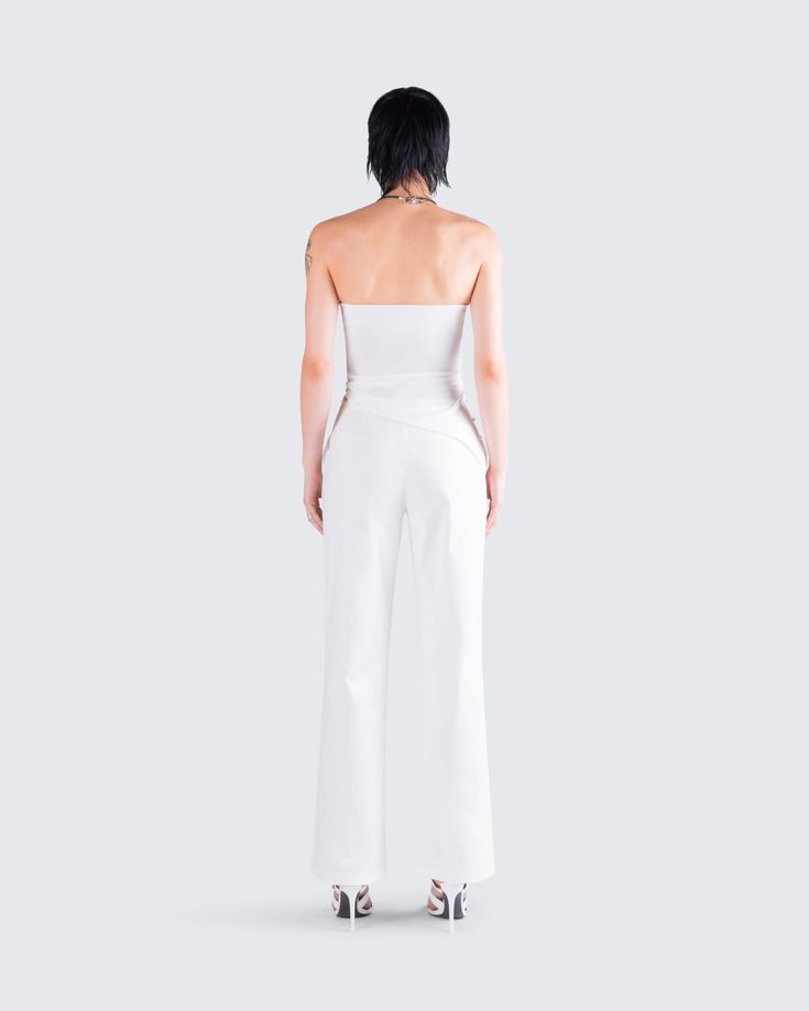 Nothing beats a monochromatic fit 🤍 Featuring an ivory symmetrical top, paired with low rise tie pants - this ensemble exudes effortless chicness in a way that will impress them all 🤩 Chic Stretch Summer Pantsuit, Elegant Cropped Bottoms For Date Night, Modern White Party Tops, Modern White Party Top, Elegant Stretch White Pantsuit, Chic Fitted Summer Pantsuit, Chic White Stretch Pantsuit, Elegant White Cropped Bottoms, Chic White Pantsuit For Spring