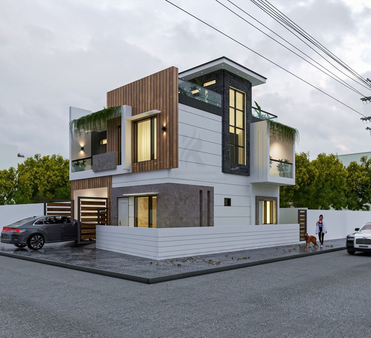 two cars parked in front of a modern house