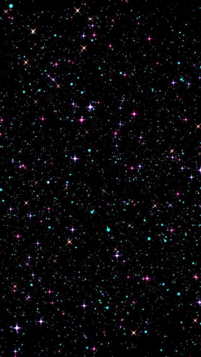 an image of stars in the night sky with many colors and sparkles on them