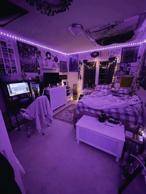 a bedroom with purple lights on the ceiling