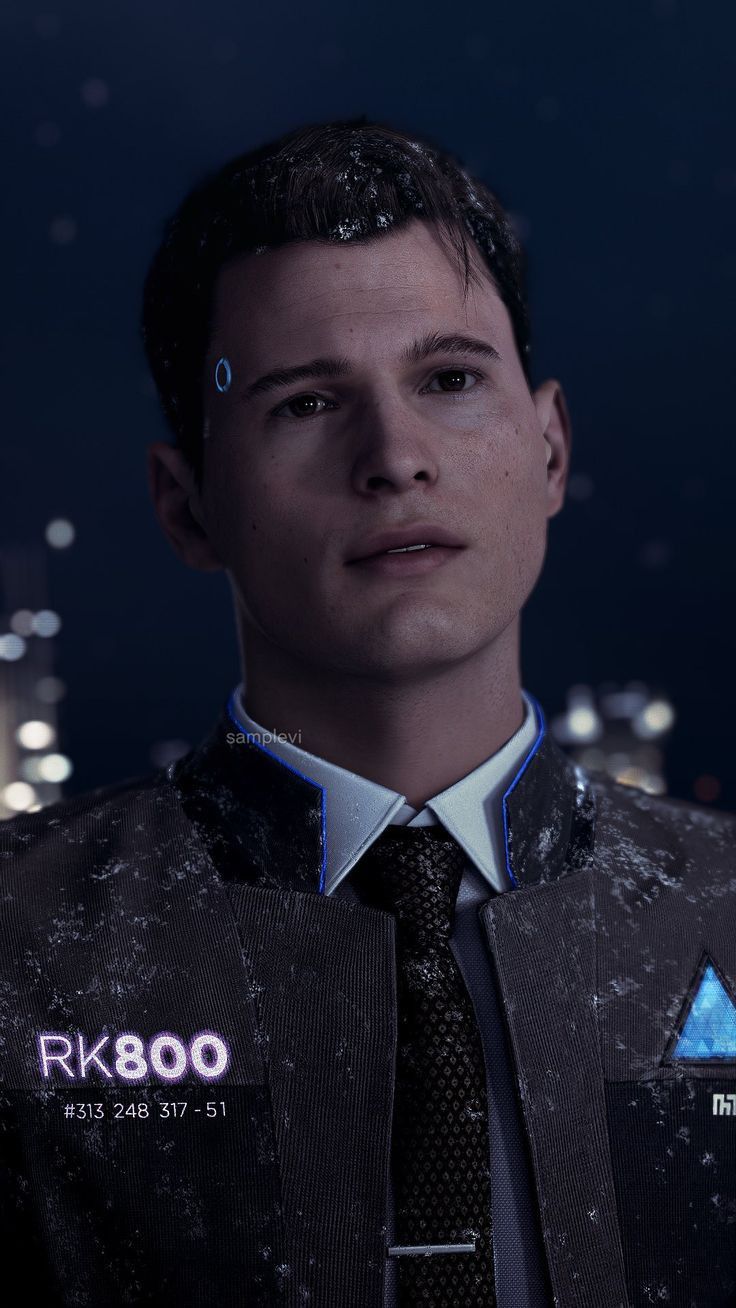 a man wearing a tie and vest in front of a cityscape at night