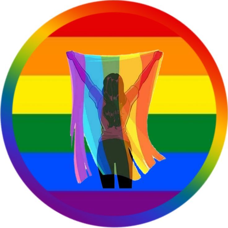 a woman standing in front of a rainbow colored circle with her arms spread wide open