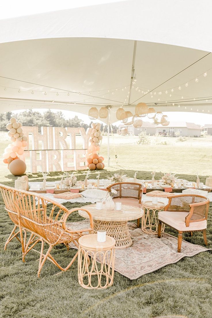 tables and chairs are set up under a tent