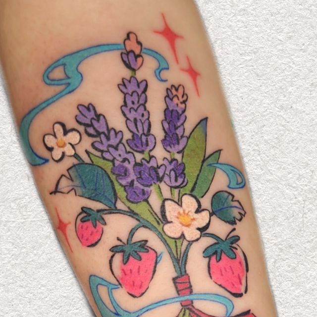 a tattoo design with flowers and strawberries on the left arm, which is decorated with blue ribbon