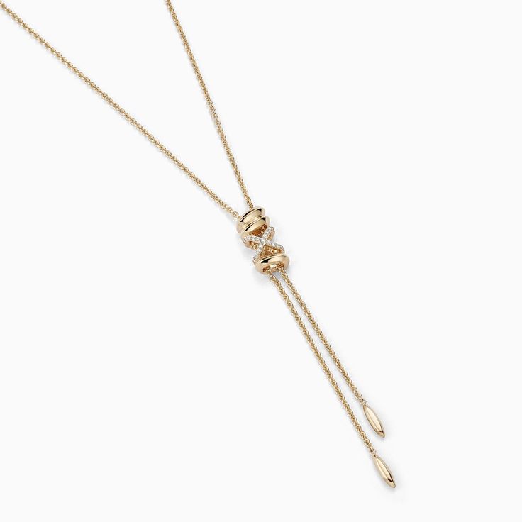 This Iconic X Lariat Necklace invites you to uncover your inner treasures through its bold and iconic design, making a definitive statement of discovery and self-expression. Accent diamonds: 0.05+ ctw, VS2+/F+ Setting: Prongs setting Pendant dimensions: 72 x 6 mm approx. Chain Type: Ovale Trace Closure: Lobster clasp Yellow Gold Lariat Necklace With Detachable Pendant As Gift, Elegant Tarnish Resistant Lariat Jewelry, Elegant Tarnish-resistant Lariat Jewelry, Luxury Yellow Gold Pendant Lariat Necklace, Luxury White Gold Lariat Necklace With Long Drop, Luxury White Gold Long Drop Lariat Necklace, Elegant Rose Gold Lariat Necklace With Delicate Chain, Luxury Long Drop Lariat Necklace In White Gold, Elegant Lariat Necklace, Tarnish Resistant