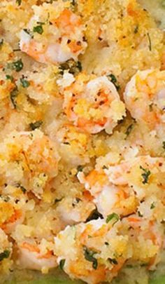 a casserole dish with shrimp, cheese and herbs in it is ready to be eaten