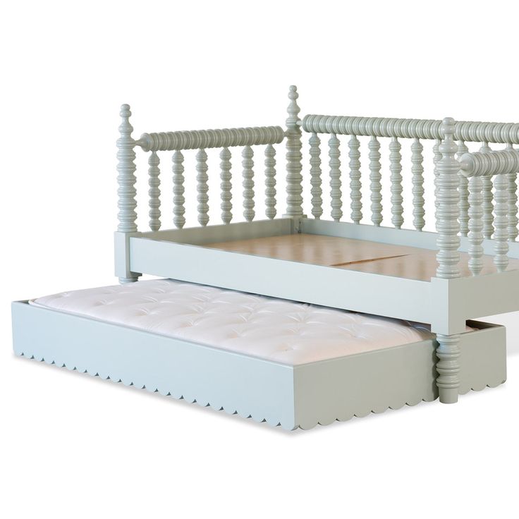 a white bed frame with two drawers underneath it