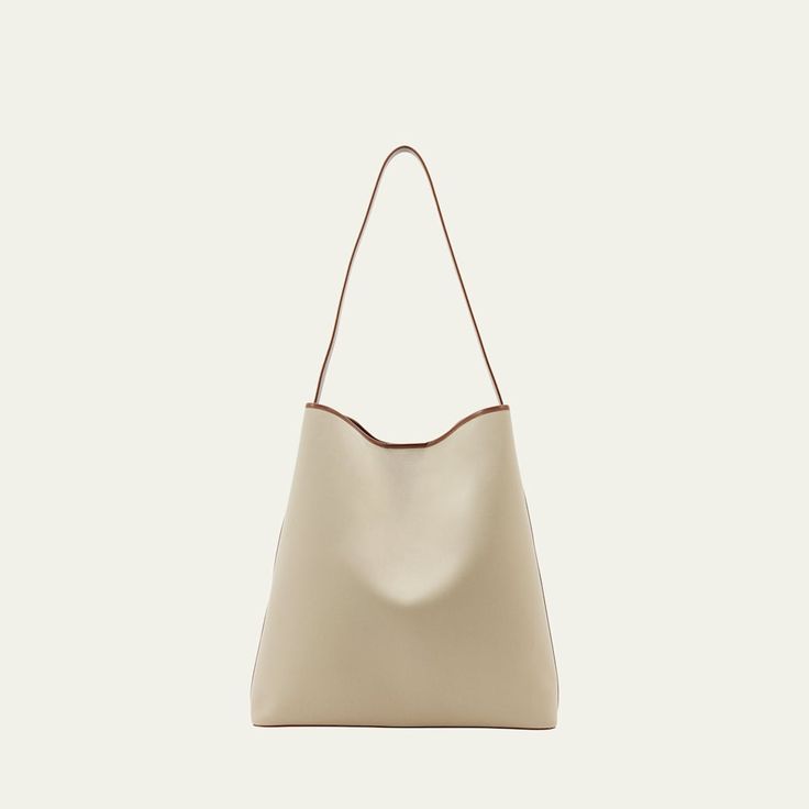 Aesther Ekme "Sac" hobo bag in cotton and faux leather (polyurethane) Shoulder strap  Open top with magnetic closure  Approx. 14.6"H x 14.2"W x 4.3"D Made in Spain Classic Large Capacity Hobo Bag For Errands, Versatile Beige Hobo Bag With Leather Handles, Classic Hobo Bag With Detachable Strap For Shopping, Everyday Beige Hobo Bag With Leather Handles, Beige Baguette Bag With Leather Handles For Daily Use, Beige Soft Leather Bucket Bag For Errands, Cream Bucket-shaped Hobo Bag, Versatile Bucket Bag With Magnetic Closure For Everyday Use, Chic Leather Canvas Bag With Adjustable Strap