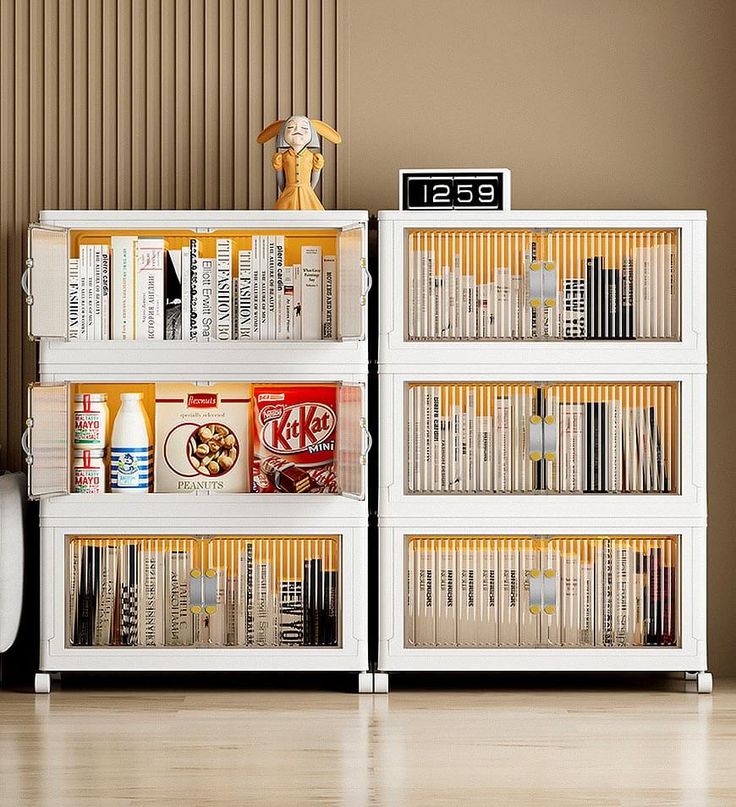 a white book shelf filled with lots of books