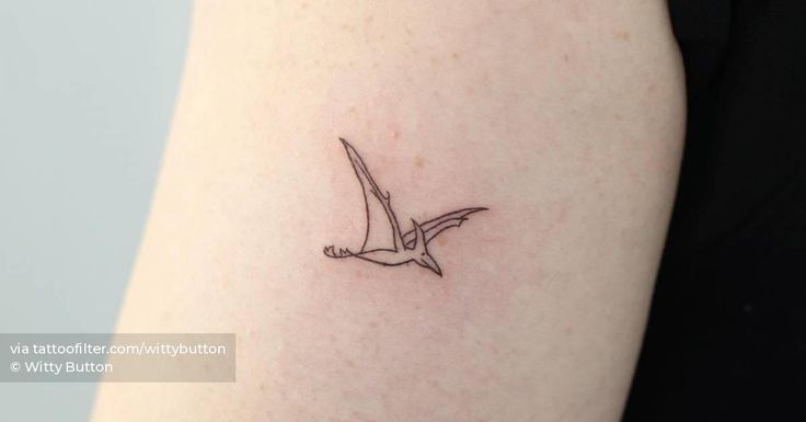 a small bird tattoo on the left upper arm and lower arm, which is black and white