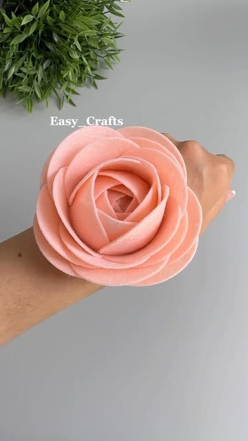 a person's arm with a pink flower on it and the words easy crafts above it