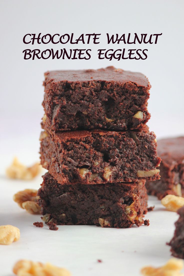 chocolate walnut brownies are stacked on top of each other with the words, chocolate walnut brownies eggless