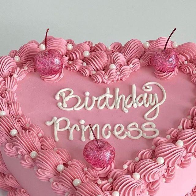 a heart shaped birthday cake with pink frosting and white writing on the top that says, birthday princess