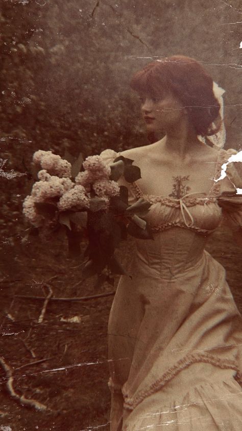 an old photo of a woman holding flowers