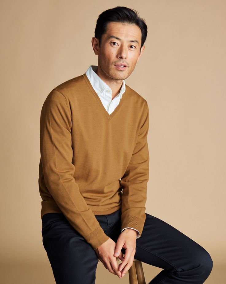 Merino V-Neck Jumper - Gold | Men's Charles Tyrwhitt Merino V-Neck Sweater - Gold Yellow Size Large Wool Luxury Cashmere V-neck Sweater For Men, Luxury Polo Sweater With Fold Down Collar For Fall, Luxury Cozy Polo Sweater For Fall, Fall Polo Sweater With Fold Down Collar, Luxury Classic Brown Polo Sweater, Luxury Brown Classic Polo Sweater, Dark Brown V Neck Sweater Men, Casual Polo Shirt For Fall, Formal Luxury Polo Sweater For Fall