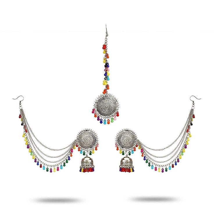 A lovely 3 Piece Multi Colored set consisting of Pair of Earrings and a Maang Tikka. Women Love Jewelry as it not only enhances their beauty, but also gives them the social confidence. This Piece of Jewelry will enhance your beauty and compliment your dress. You can team these type of earrings with any traditional attire, with and casual cotton palazzo and kurti Usage : trendy daily wear, designer wear, traditional wear this necklace is stunning and preciously suitable for all special occasions Boho Traditional, Bollywood Wedding, Types Of Earrings, Traditional Attire, Jewelry Choker, Gold Tone Necklace, Bridal Pearls, Designer Wear, Indian Jewelry