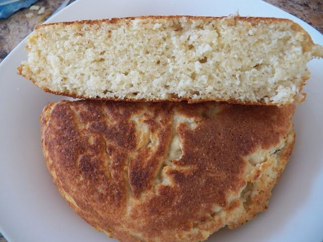 two pieces of bread sitting on top of a white plate