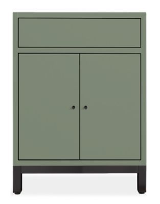 a green cabinet with two doors and black legs