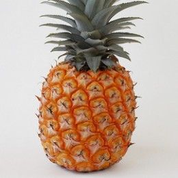 a pineapple sitting on top of a white table