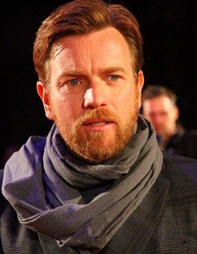 a man with a scarf around his neck