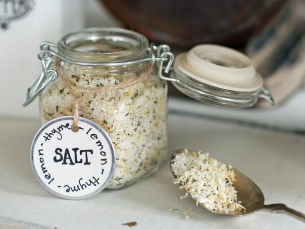 a jar filled with salt next to a spoon