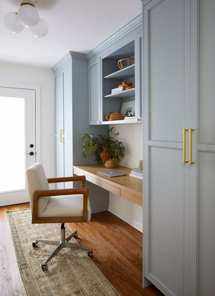 a chair sits in front of a wooden desk