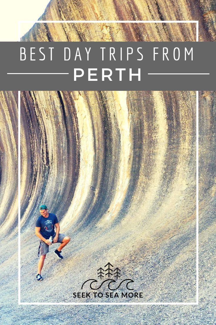 a man standing in front of a rock formation with the words best day trips from perh