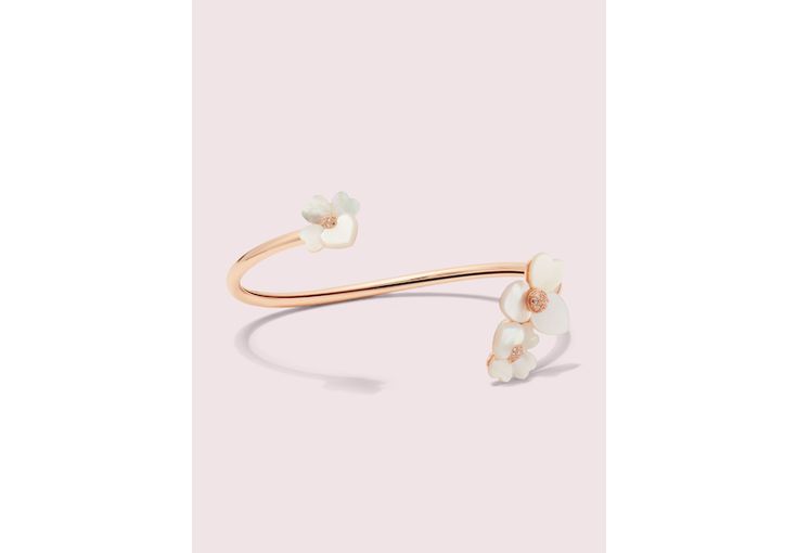 handcrafted of rose gold-tone metal and mother-of-pearl shell our precious pansy collection is true to its name. and this flex cuff is designed with lots of thoughtful details: like the sparkly crystal centers and heart-shaped petals. did you notice the larger ones? they're a nod to our signature mark. | Kate Spade Precious Pansy Flex Cuff, Cream/Rose Gold Elegant White Kate Spade Bracelet, Kate Spade Elegant Bangle Jewelry, Spring Formal Rose Gold Jewelry, Spring Wedding Rose Gold Jewelry, Spring Gift Jewelry By Kate Spade, Elegant Rose Gold Bracelets For Spring, Kate Spade Feminine Wedding Jewelry, Feminine Kate Spade Jewelry For Wedding, Feminine Kate Spade Wedding Jewelry