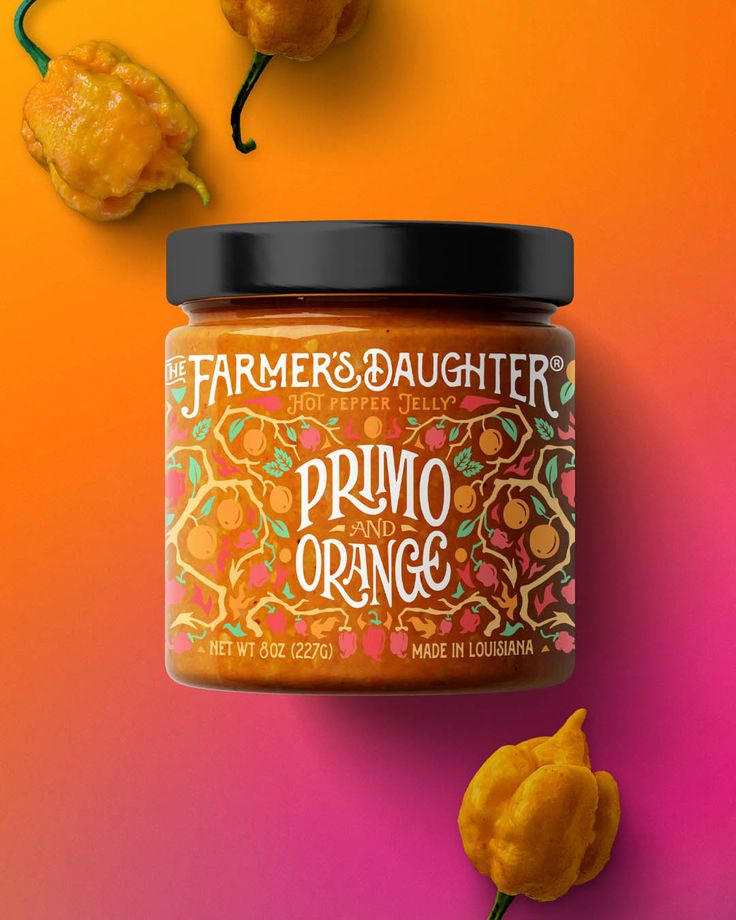 a jar of orange marmalade sits next to some fruit on an orange and pink background