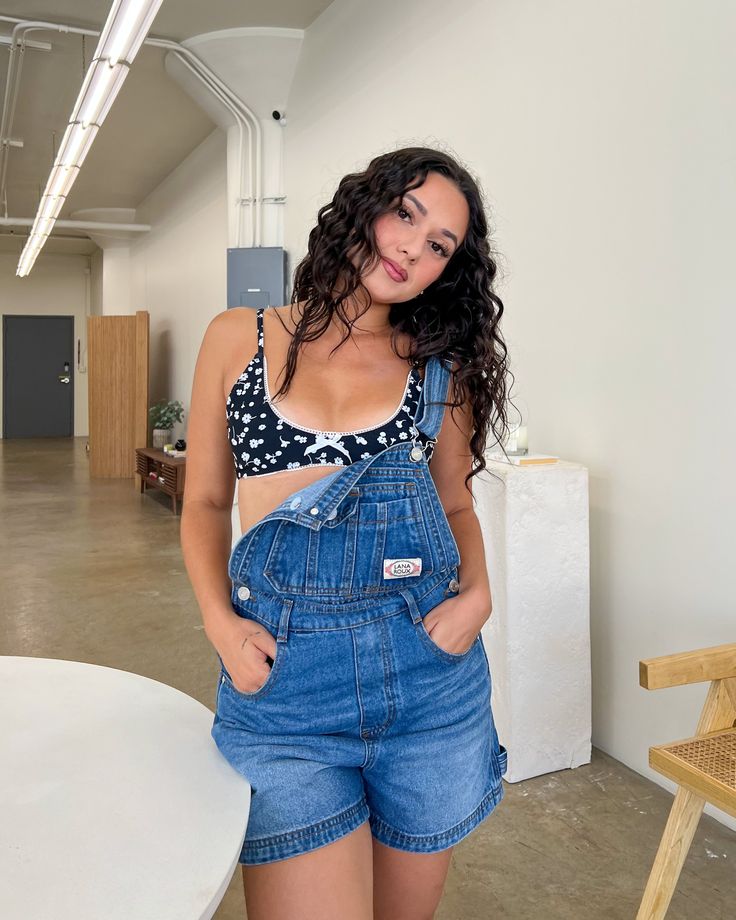 Meet your new go-to overalls for this summer. The Becca Denim Short Overalls are your perfect 90s-inspired overalls with their oversized fit. Pair with your favorite little tee underneath and tote bag for the cutest casual look for every day. Denim overalls Whisker effect 100% Cotton Traditional straps High-rise Button closures on both sides 5-pocket design Oversized, relaxed fit Full length: 34" Inseam: 3.5" First model, Georgia is wearing size X-Small Second model, Jocelyn is wearing size Smal Trendy Dark Wash Summer Overalls, Trendy Summer Shortalls With Bib Front, Trendy Summer Bib Front Shortalls, Trendy Summer Relaxed Fit Shortalls, Summer Utility Shortalls With Relaxed Fit, Trendy Dark Wash Shortalls For Spring, Summer Utility Style Relaxed Fit Shortalls, Trendy Relaxed Fit Shortalls, Trendy Relaxed Fit Medium Wash Shortalls