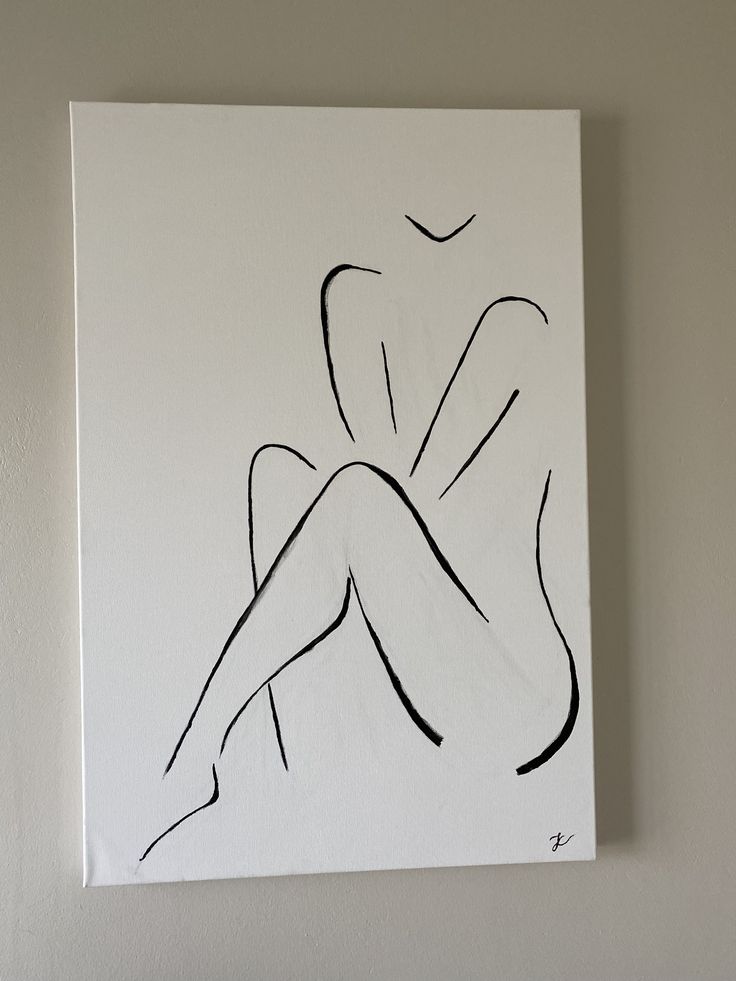 a drawing of a woman's legs on a white canvas hanging on a wall