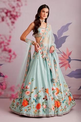 Sea green lehenga with floral printed motifs and embroidered waistband. Comes with sleeveless blouse and organza dupatta.
Component: 3
Pattern: Print and Embroidery
Type Of Work: Floral Print, Pearl and Cutdana
Neckline: Scoop
Sleeve Type: Sleeveless
Fabric: Silk and Organza
Color: Green
Other Details: 
Dupatta with floral printed border
Closure: Back zip
Occasion: Wedding - Aza Fashions Ridhi Mehra, Skirt Silk, Green Lehenga, Green Floral Print, Embroidered Wedding, Wedding Lehenga, Silk Lehenga, Organza Dupatta, Embroidered Skirt