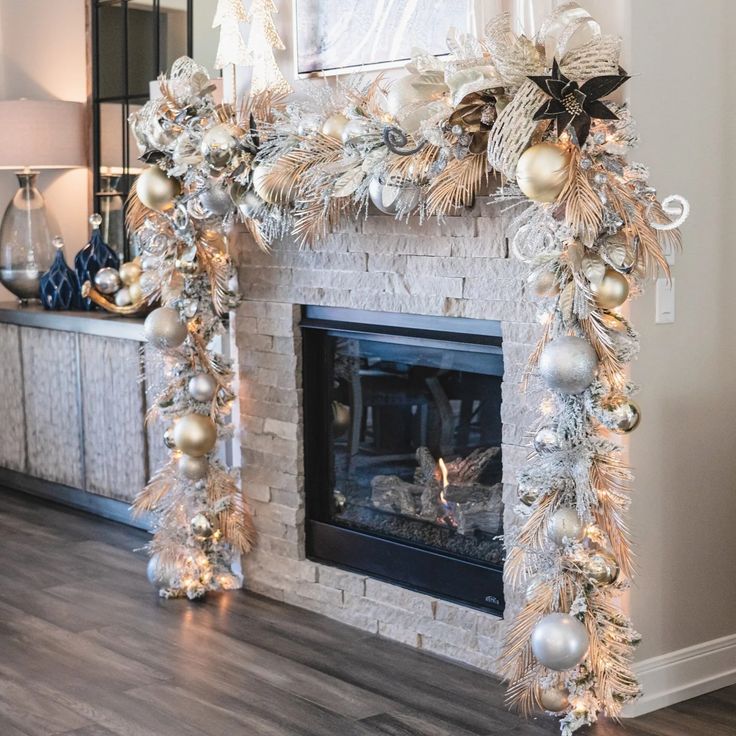 a fireplace decorated with silver and gold ornaments