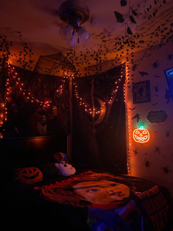 a bedroom decorated with halloween decorations and lights