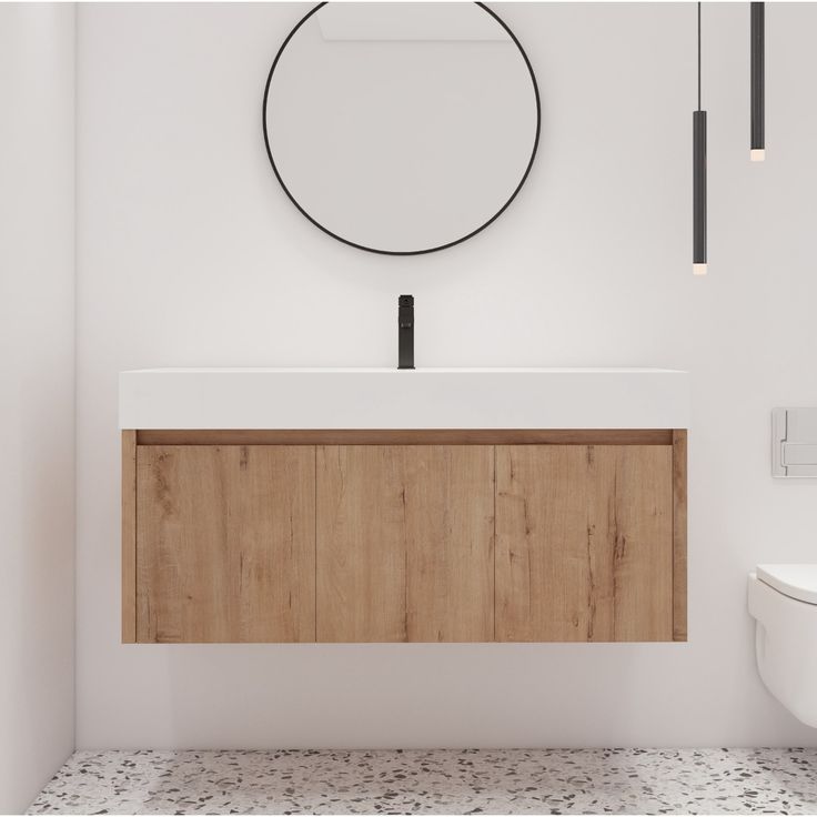 a bathroom with a sink, mirror and wooden cabinet in front of the toilet bowl