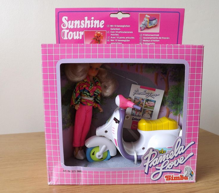 a toy scooter with a doll in the box