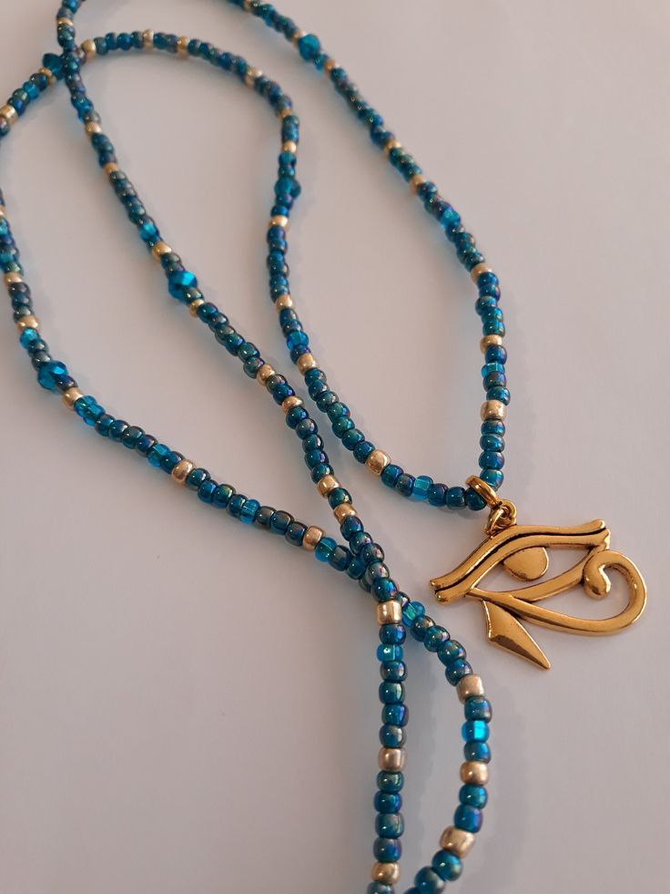 Waistbeads, made with 4mm gold and turquoise blue, glass and crystal seed beads, 6mm Czech glass beads, and gold plated pewter 'eye of Horus' charm. Beads are on heavy elastic cord. Wrap 4 times for bracelet, 3 times for anklets, and open for necklace. Gold Waist Beads, Belly Beads, Man Jewelry, Cord Wrap, Turquoise And Gold, Waist Beads, Eye Of Horus, Charm Beads, Gold Eyes