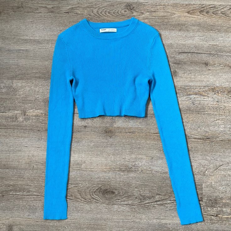 Pull And Bear Knit Long Sleeve Crop Top In Blue. Very Breathable And Light. In The Size Small. Tight Fit And Very Flattering. Never Worn Trendy Cropped Blue Sweater, Blue Ribbed Crew Neck Crop Top, Blue Ribbed Crop Top With Crew Neck, Blue Ribbed Stretch Crop Top, Blue Stretch Ribbed Crop Top, Blue Ribbed Stretch Sweater, Blue Stretch Ribbed Sweater, Trendy Blue Ribbed Sweater, Blue Fitted Casual Sweater