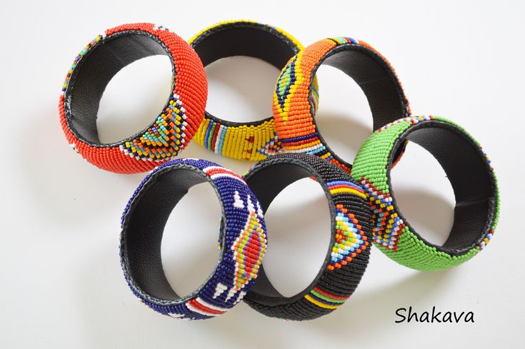 African tribal beaded bracelets African jewelry handmade bangles multicolored bangles African fashion tribal bracelets accessories gift PRODUCT SPECIFICATIONS: Bracelet inner diameter - 7.0 cm Colors - multiple colors Materials - beads, plastic tube ADDITIONAL INFORMATION New and unworn: Yes Handmade in Kenya: Yes Other jewelry in my shop: https://www.etsy.com/shop/shakava Traditional Multicolor Beaded Bangle Bracelets, Colorful Beaded Bangle For Festivals, Handmade Multicolor Cuff Bracelet For Festivals, Festival Colorful Bead Bangle, Multicolor Cuff Bracelet For Festivals And Gifts, Multicolor Festival Bangle Bracelet, Traditional Colorful Handmade Bracelets, Multicolor Cuff Bracelet As Gift For Festivals, Traditional Multicolor Handmade Cuff Bracelet