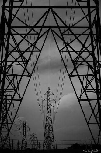 black and white photograph of high voltage power lines