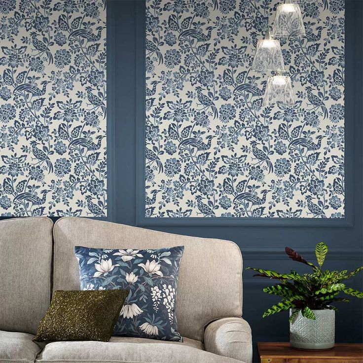 a living room with blue and white wallpaper