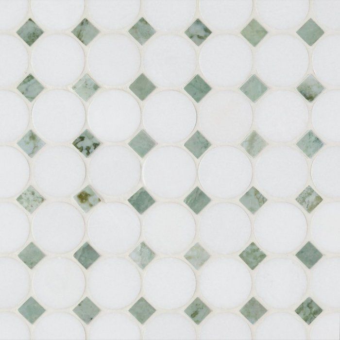 a white and green mosaic tile pattern