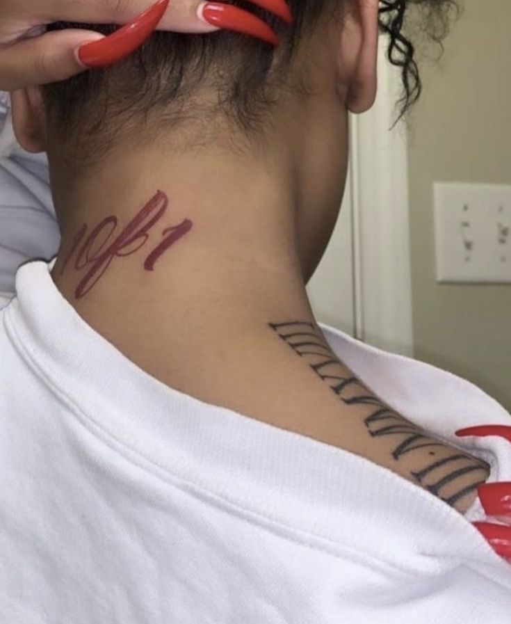 a woman with a tattoo on her neck has the number 11 on her left side