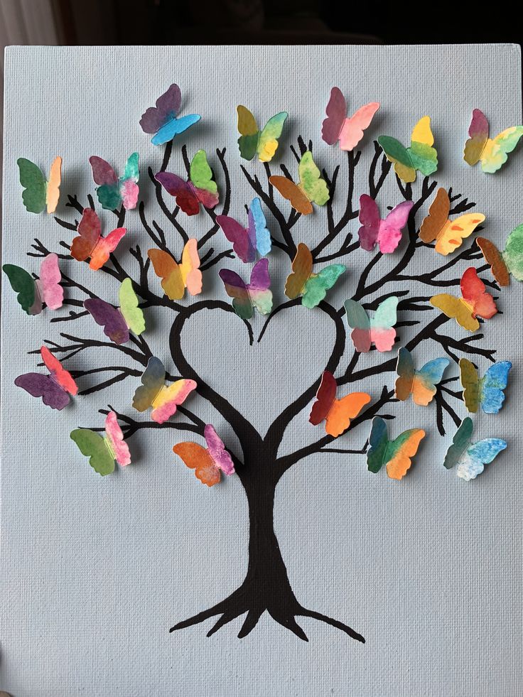 a tree made out of colored paper and cut into the shape of a heart