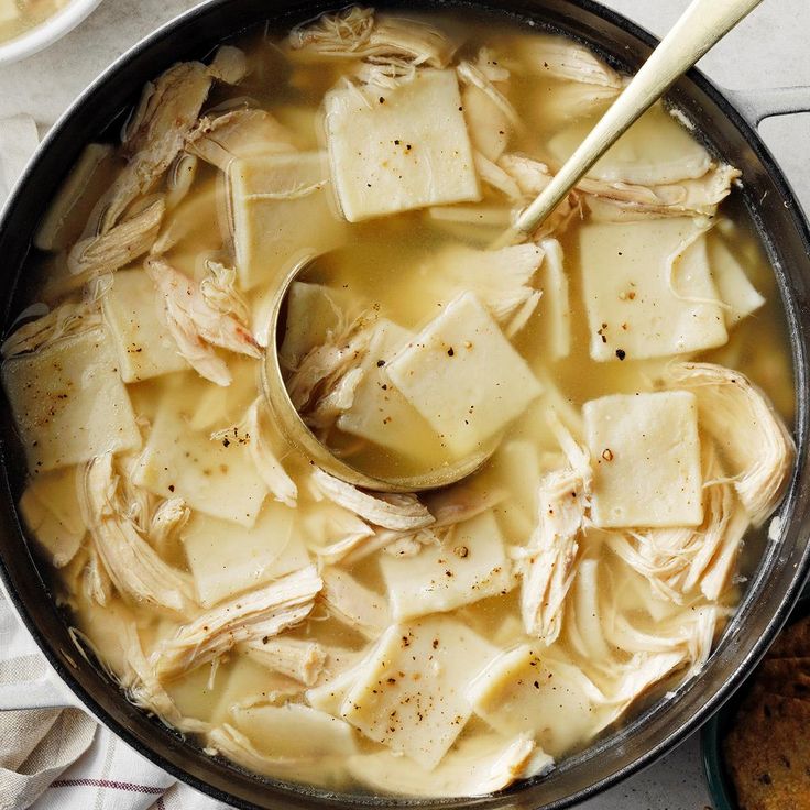 a pot filled with food and a spoon in it