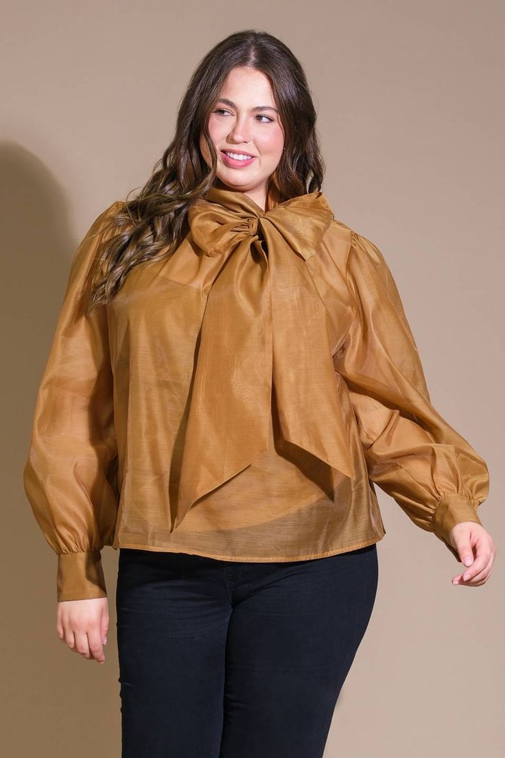 A solid organza top featuring front bow tie, long blouson sleeve with cuff and cami Details: Self : 100% PolyesterLining : 100% Polyester Size & Fit - Model is 5`8" And Wearing Size Small- Measurements Taken From Size Small- Approx. Length: 23.5" Organza Top, Blouson Sleeve, Bow Tie, Camel, Fitness Models, Womens Shirts, Cuff, Size Small, How To Wear