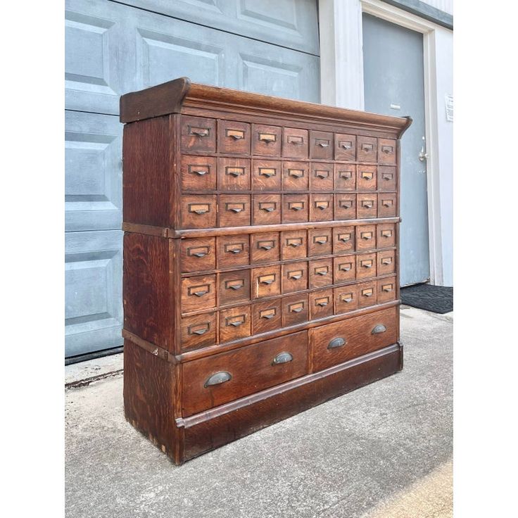 an old wooden dresser with many drawers